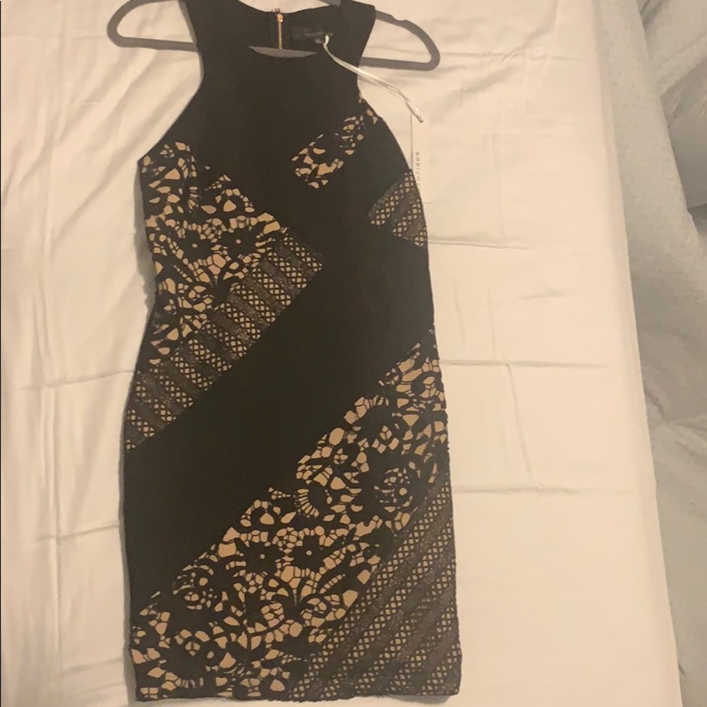Black and Nude dress size medium, never worn.